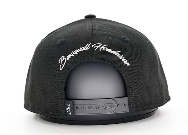 Back of Custom Mens Black Embroidery Cotton Snapback Hat with a White Cross logo