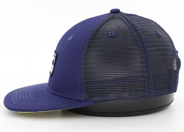 Side of Custom Blue 6 Panel Snapback Trucker Hat with Patch Logo