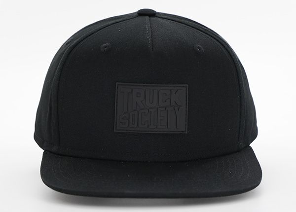 Front of All Black Snapback Hat With Leather Label