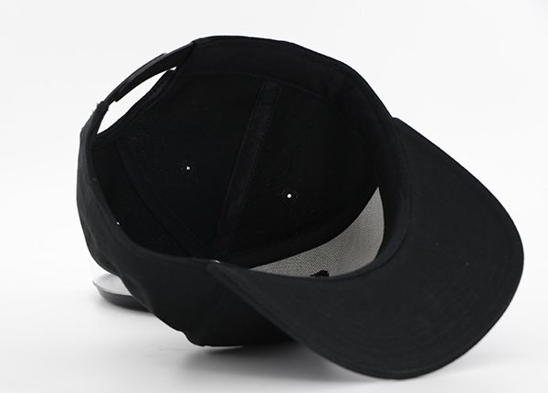 Inside of All Black Snapback Hat With Leather Label