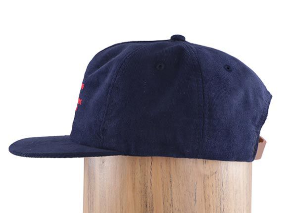 Side of Custom Navy Blue Corduroy Snapback Cap With Leather Strap Back