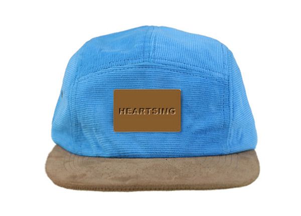 Front of Baby Blue 5 Panel Hat with Brown Suede Brim and a Leather Label