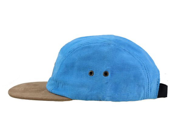 Side of Baby Blue 5 Panel Hat with Brown Suede Brim and a Leather Label