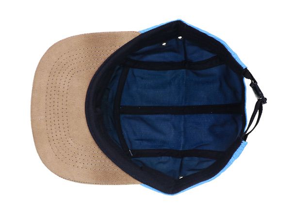 Inside of Baby Blue 5 Panel Hat with Brown Suede Brim and a Leather Label