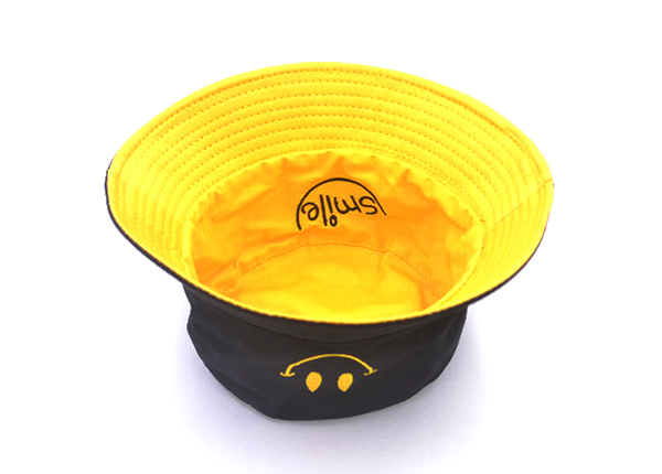 Inside of Reversible Black Bucket Hat with a Smile Logo
